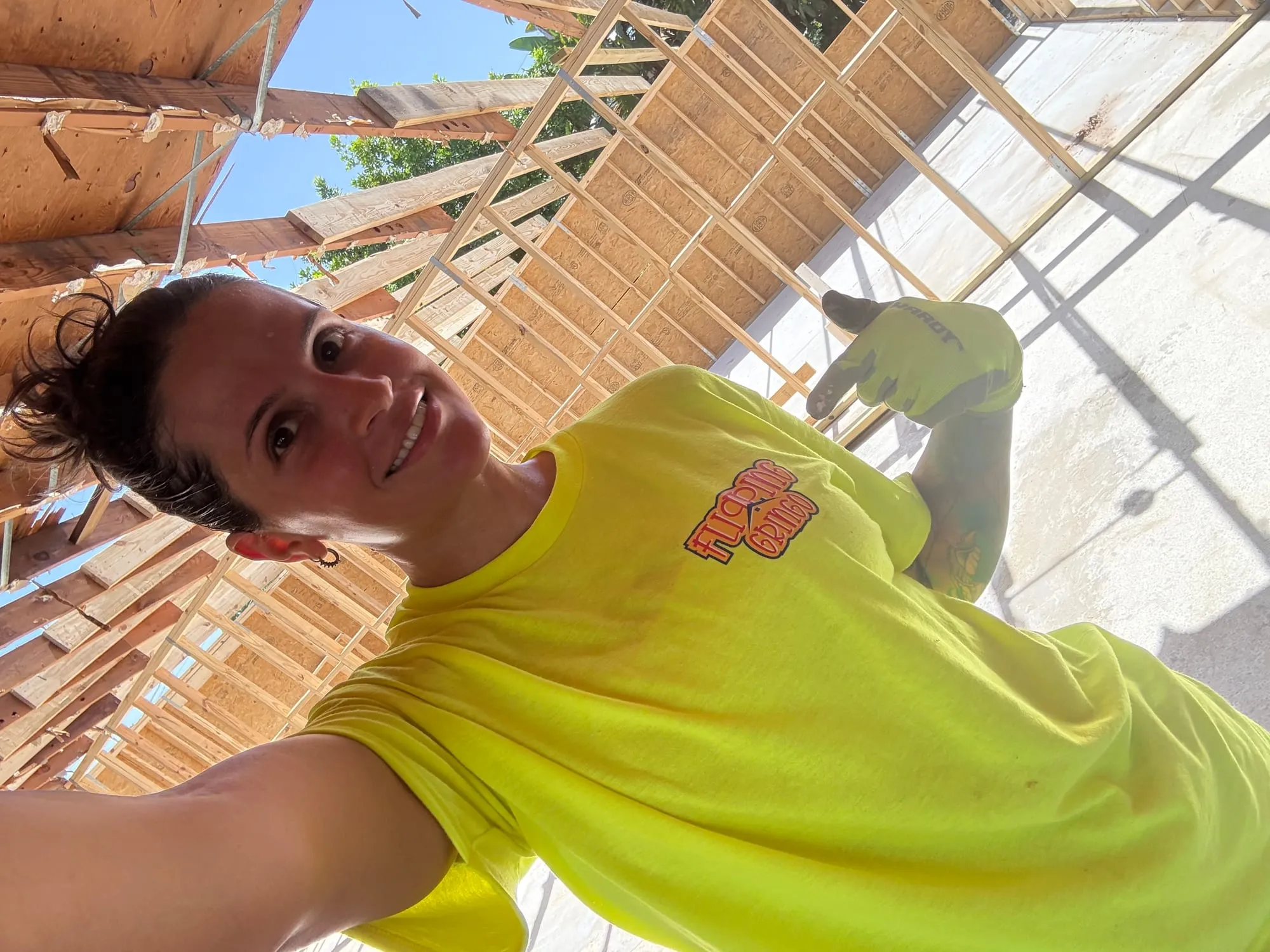 A Flipping Gringo team member at a framing-stage build